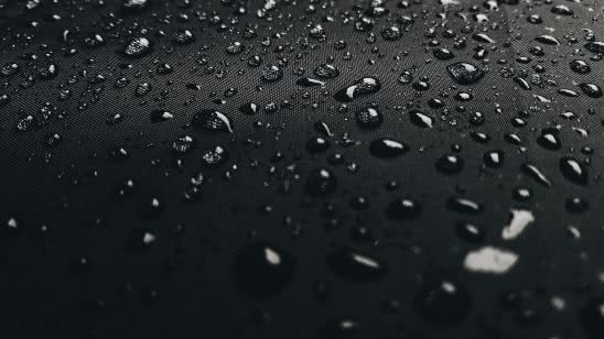 water drops on black surface uhd 4k wallpaper